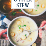 Overhead shot of hands eating a bowl of oyster stew with text title overlay