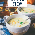 Side shot of bowls of oyster stew with text title overlay