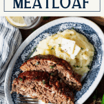 Overhead shot of southern style meatloaf recipe on a plate with mashed potatoes and text title box at top