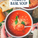 Overhead image of hands eating a bowl of tomato basil soup with text title overlay