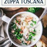Overhead image of a bowl of Olive Garden Zuppa Toscana Soup recipe with text title box at top.