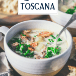 Close up side shot of a bowl of Olive Garden Zuppa Toscana soup with text title overlay
