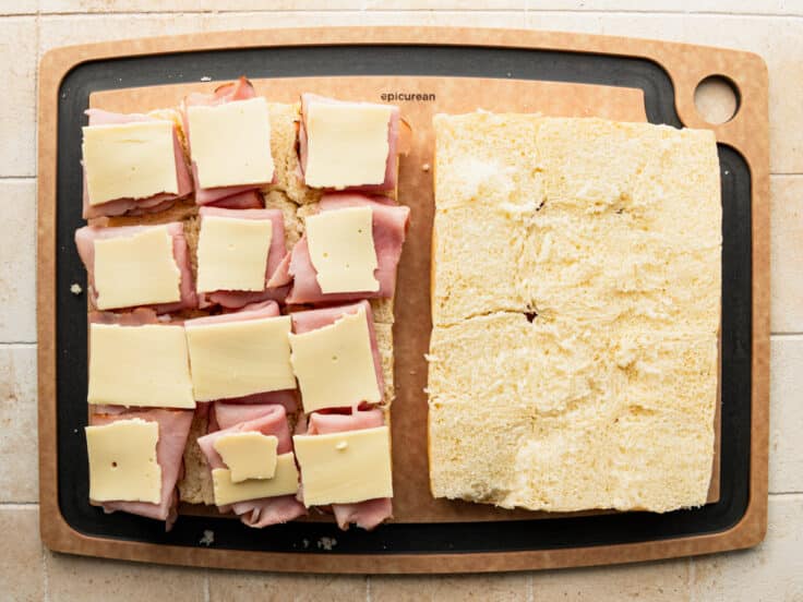 Process shot showing how to make ham and cheese sliders.