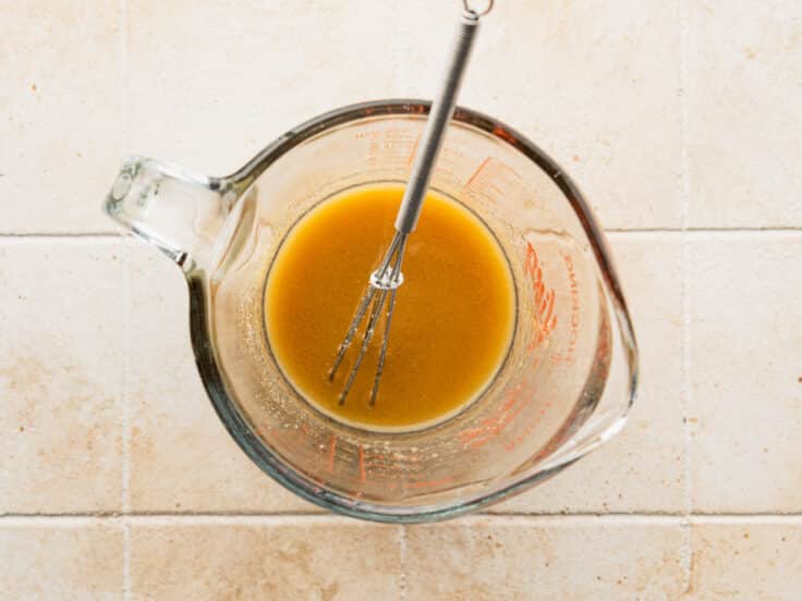 Whisking the butter and brown sugar sauce for sliders.