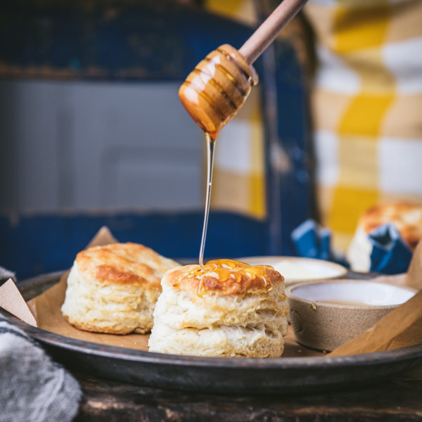 Drizzling honey over the best 3 ingredient biscuit recipe