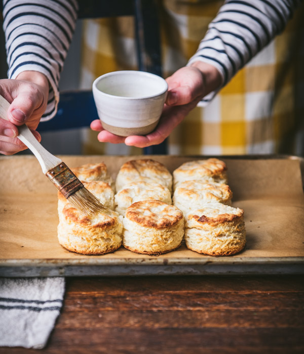 Brushing buttermilk biscuits with melted butter