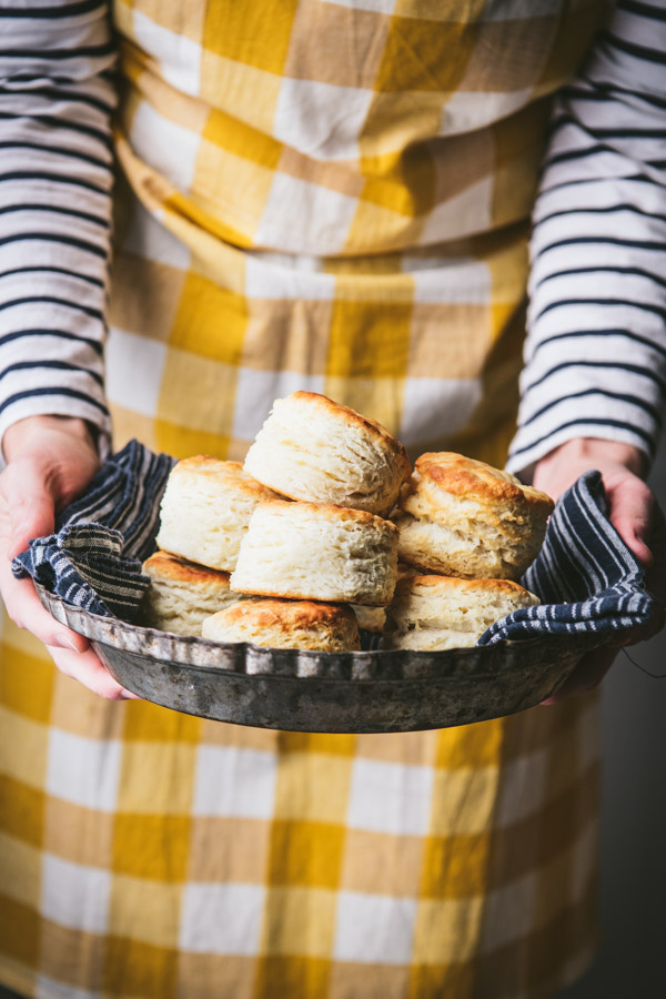 Holding a pan of buttermilk biscuits