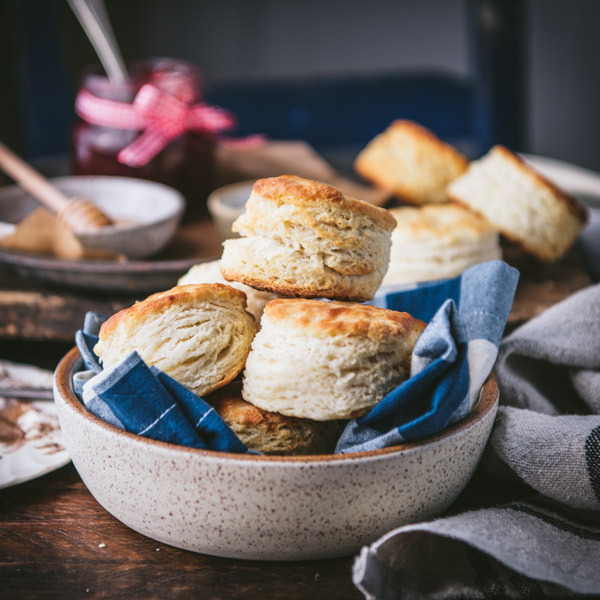 Side shot of 3 ingredient buttermilk biscuits on a dinner table