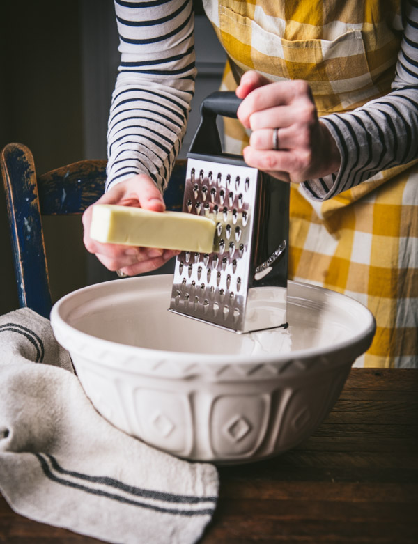 Grating butter into a bowl