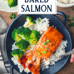 Overhead shot of baked salmon in a bowl with rice and text title overlay