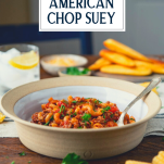 Side shot of a bowl of American chop suey with text title overlay