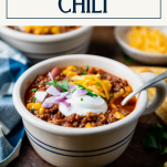 Side shot of the best beef chili recipe with text title box at top.