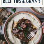 Overhead shot of hands eating a bowl of beef tips and gravy with mashed potatoes and text title box at top.