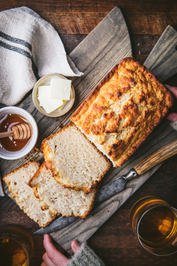 Overhead shot of the best beer bread recipe on a wooden cutting board