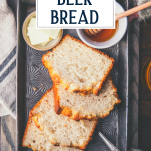 Overhead shot of easy beer bread recipe in a metal pan with text title overlay