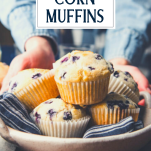 Hands serving a basket of blueberry cornbread muffins with text title overlay