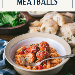 Side shot of baked chicken meatballs in a bowl with text title box at top.