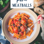 Overhead shot of hands eating a bowl of pasta with baked chicken meatballs and text title overlay