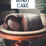Side shot of sliced chocolate bundt cake with text title overlay
