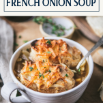 Side shot of a bowl of French onion soup with text title overlay