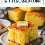Side shot of a square of cornbread with creamed corn with text title box at top.