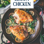 Overhead shot of hands holding a pan of roasted lemon chicken breast with text title overlay