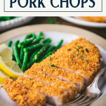 Close up side shot of baked breaded pork chops with text title box at top.