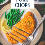 Overhead shot of sliced breaded pork chops on a plate with text title overlay.