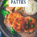 Close overhead image of salmon croquettes on a plate with text title overlay
