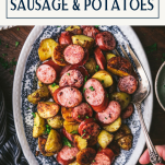Serving from a plate of sausage and potatoes with text title box at top