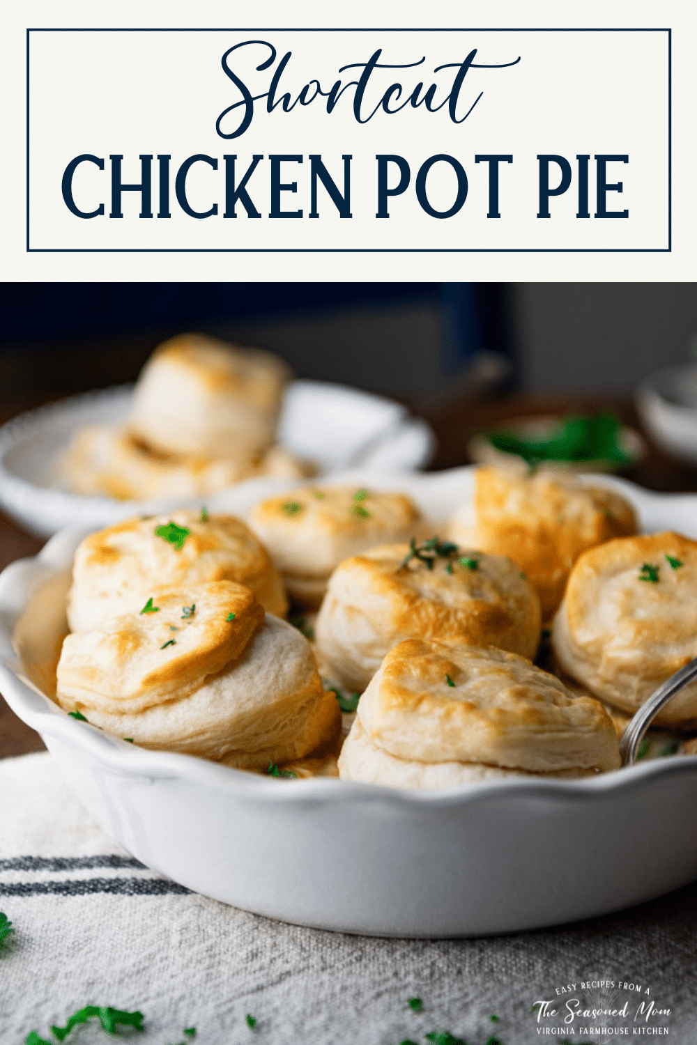 Side shot of chicken pot pie with biscuits with text title box at top