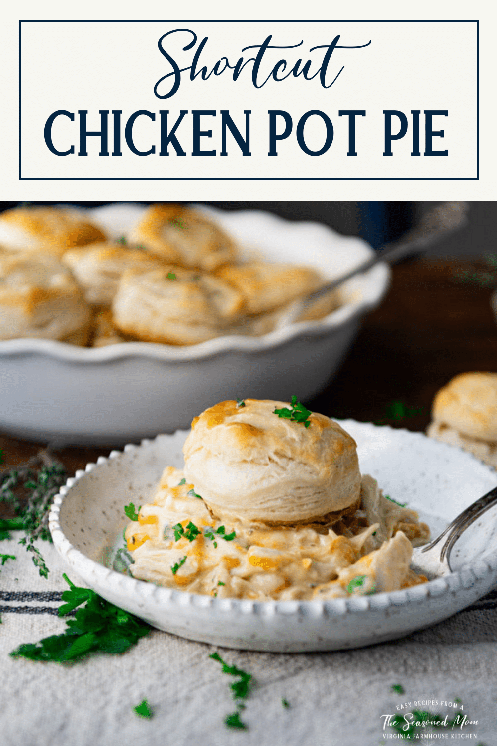Side shot of a plate of chicken pot pie with biscuits and text title box at top