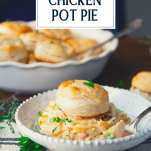 Plate of chicken pot pie with biscuits with text title overlay