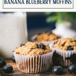 Close up side shot of a whole wheat banana blueberry muffin recipe with text title box at top.