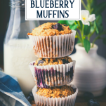Stack of whole wheat banana blueberry muffins with text title overlay.