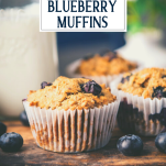 Close up side shot of whole wheat banana blueberry muffins with oatmeal and text title overlay.
