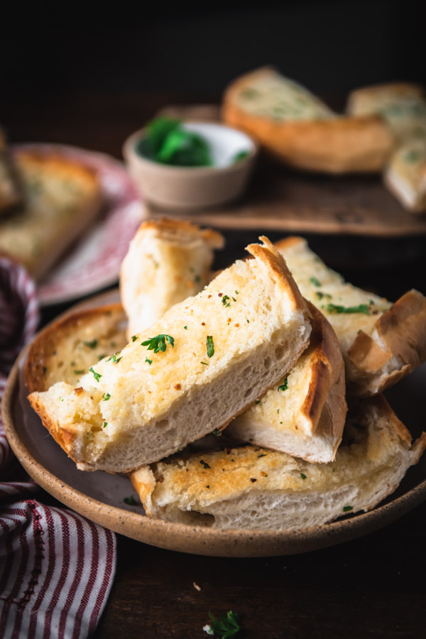Close up shot of a bowl of the best homemade garlic bread