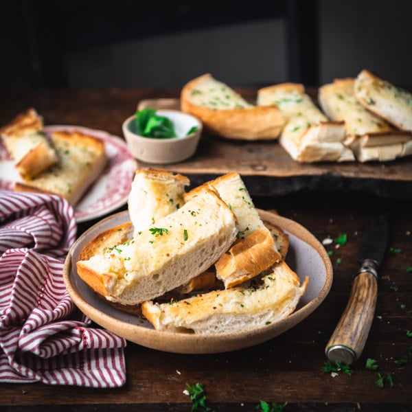 Square side shot of the best garlic bread recipe on a table