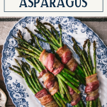 Overhead shot of a platter of bacon wrapped asparagus with text title box at top