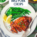 White plate with the best baked bbq pork chop recipe with text title overlay