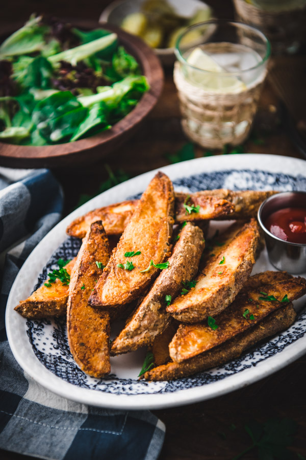 Side shot of potato wedges on a plate