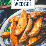 Close up shot of potato wedges on a blue and white plate with text title overlay