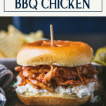 Close up side shot of crockpot bbq chicken sandwich with text title box at top