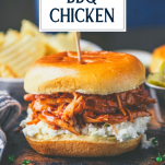 Close up side shot of crockpot bbq chicken in a sandwich with coleslaw and text title overlay