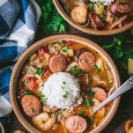 Overhead shot of two bowls of slow cooker gumbo with chicken sausage and shrimp