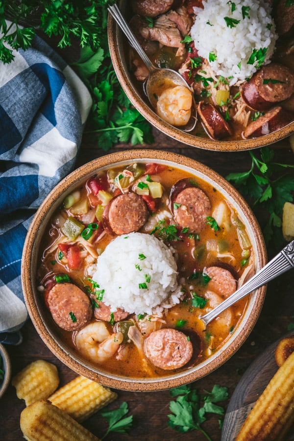 Overhead shot of two bowls of slow cooker gumbo with chicken sausage and shrimp