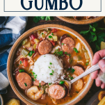 Hands eating a bowl of chicken sausage and shrimp gumbo with text title box at top