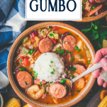 Spoon eating a bowl of crockpot gumbo with chicken sausage and shrimp and text title overlay