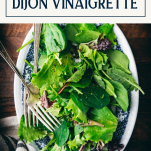 Overhead shot of salad with dijon vinaigrette with text title box at top