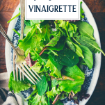 Overhead shot of a salad with dijon vinaigrette and text title overlay
